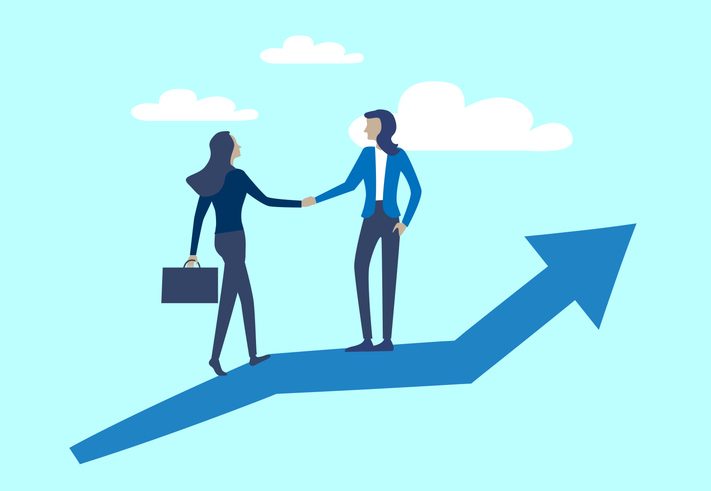 Two businesswoman shaking hands on connected growth,partnership and cooperation.