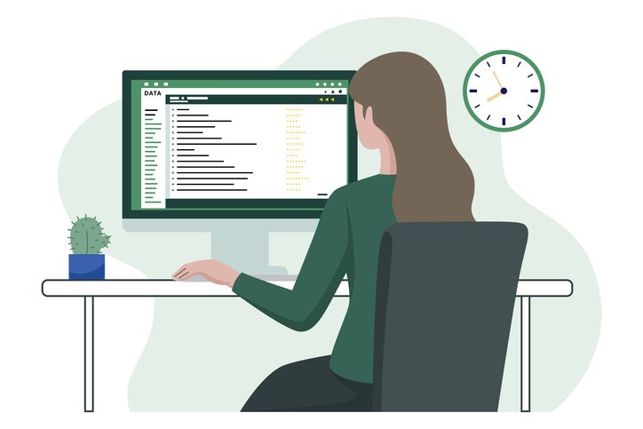 Woman sitting at computer as concept for article on choosing a UX agency for SaaS products