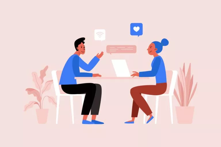 illustration shows tow people sitting across from each other at a table