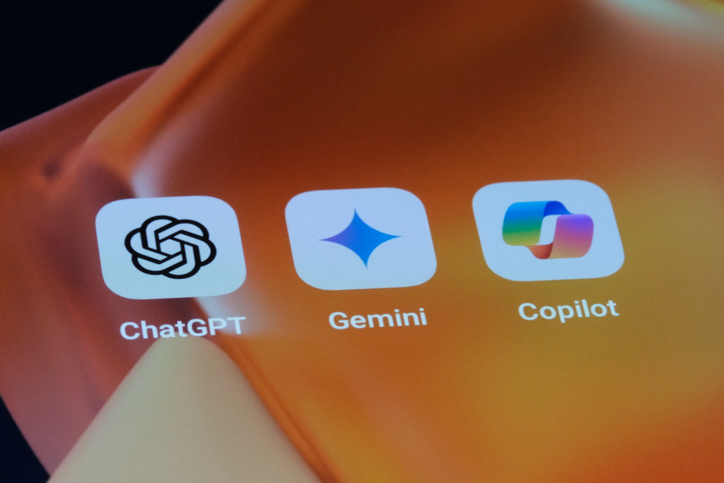 Google Gemini, OpenAI ChatGPT and Microsoft Copilot app icons on screen for article on Microsoft Copilot free vs paid